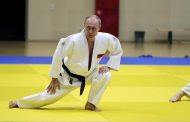 Black belt Putin shows off judo moves with Olympic athletes