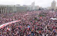 Belarus’ Lukashenko carries assault rifle as protesters demand his resignation at mass rally